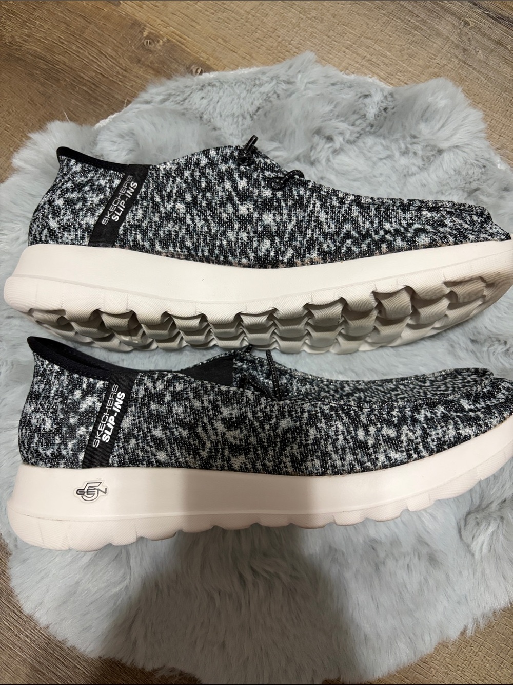 Skechers GO WALK Slip-ins featuring a black and white heathered knit upper. - Picture 4 of 8